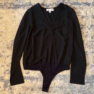 Black long sleeve Rampage bodysuit. Size medium